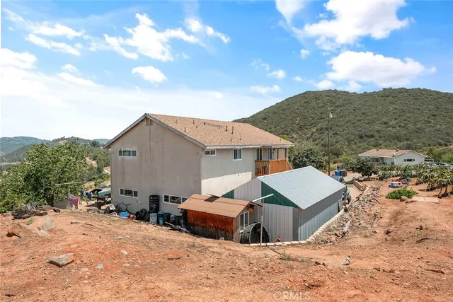 a view of a backyard of the house