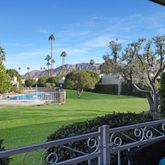 a swimming pool with outdoor seating and yard