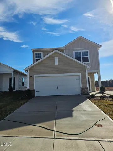 a front view of a house with a garage