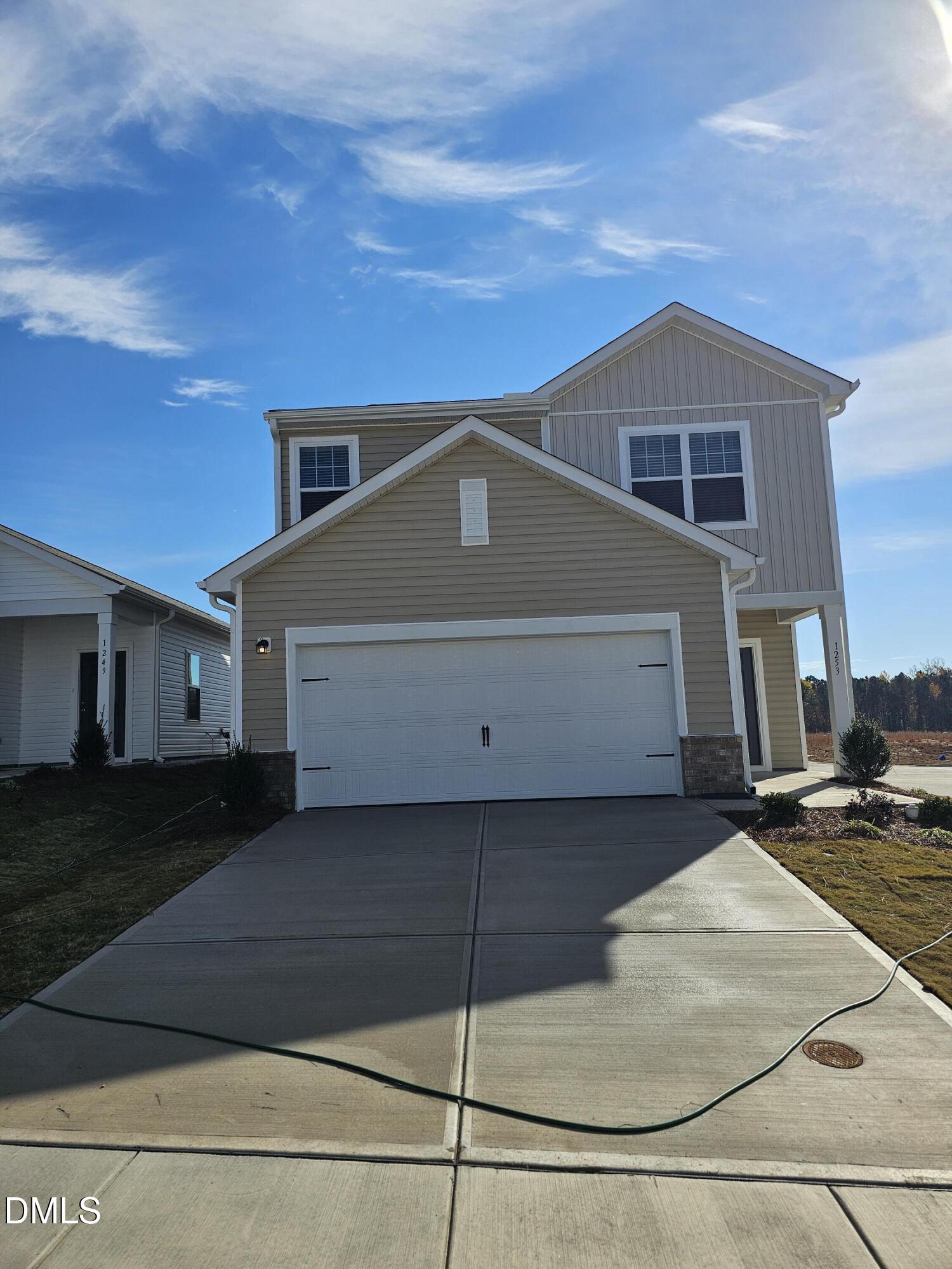 a front view of a house with a garage