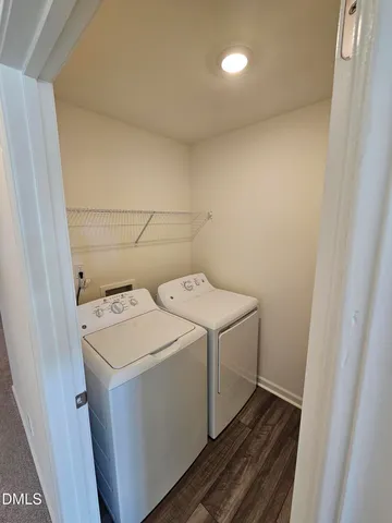 a bathroom with a granite countertop sink toilet a mirror and shower