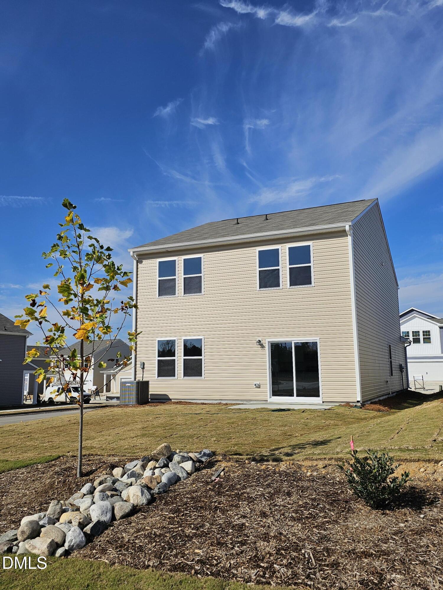 1253 Solace Way Rolesville, NC 27571 - Photo 31 of 31 a front view of a house with a yard