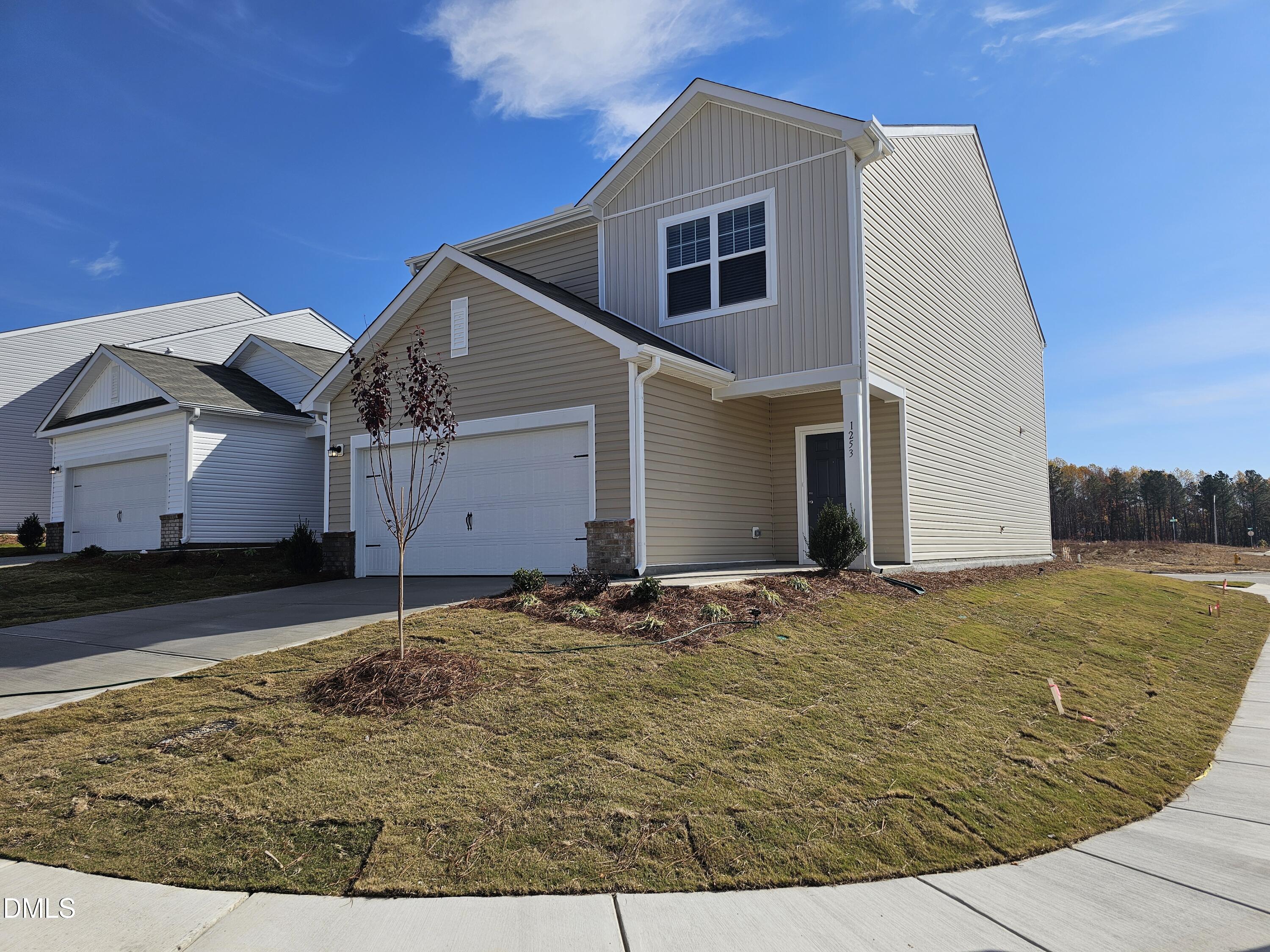 1253 Solace Way Rolesville, NC 27571 - Photo 4 of 31 a view of a house with backyard