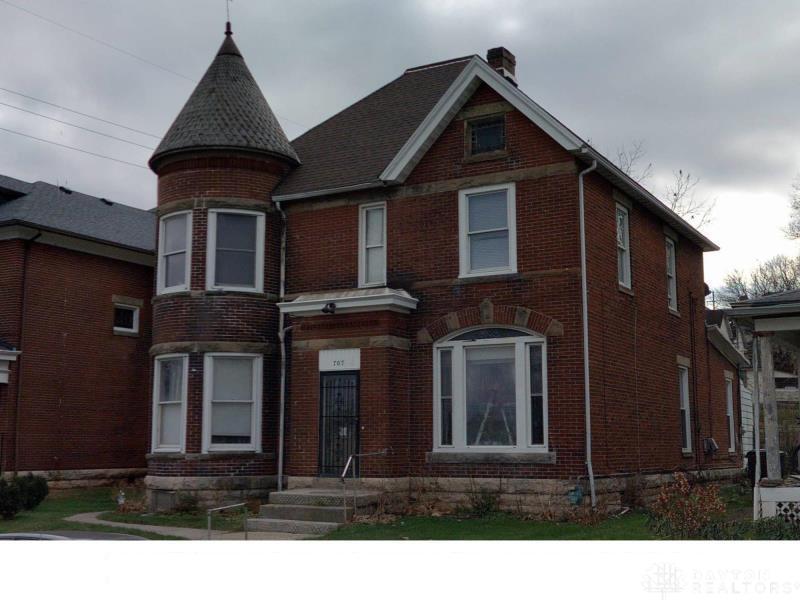707 West High Street Springfield, OH 45506 - Photo 1 of 4 This classic brick residence features an enchanting turret and distinctive architectural details.