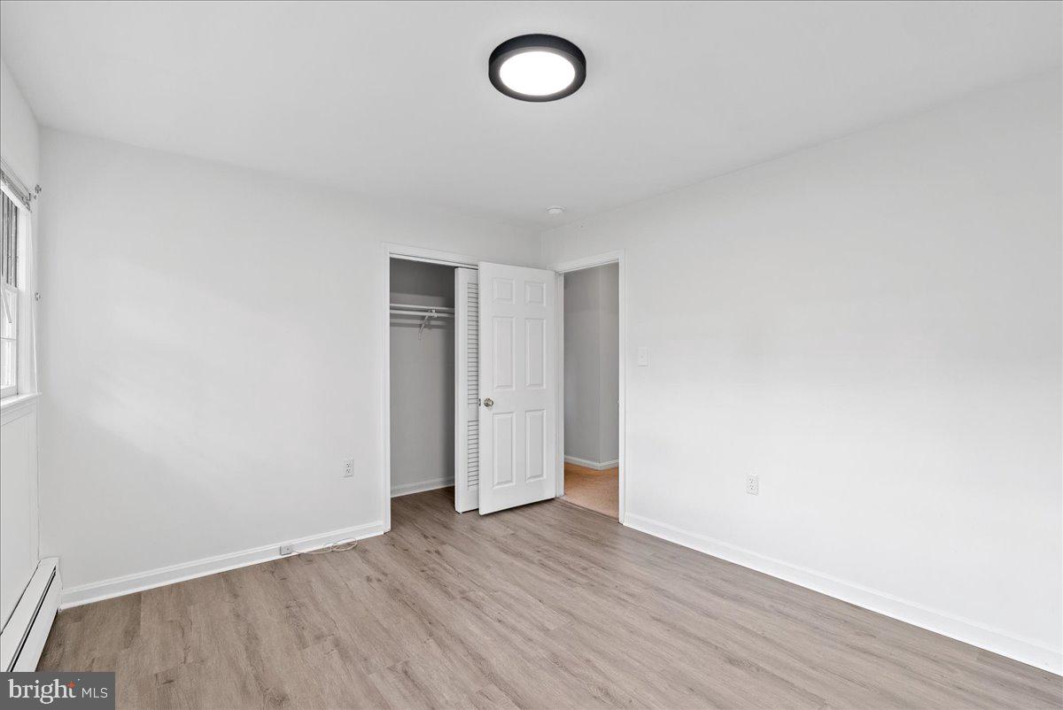 919 Ednor Road Silver Spring, MD 20905 - Photo 16 of 29 a view of room with wooden floor and ceiling fan