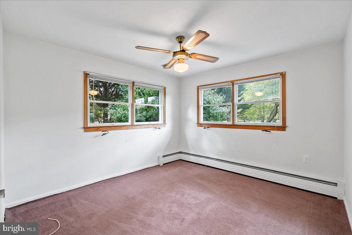 919 Ednor Road Silver Spring, MD 20905 - Photo 17 of 29 an empty room with windows and fan