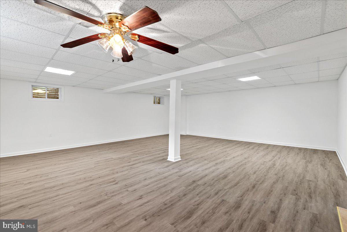 919 Ednor Road Silver Spring, MD 20905 - Photo 23 of 29 a view of an empty room with wooden floor
