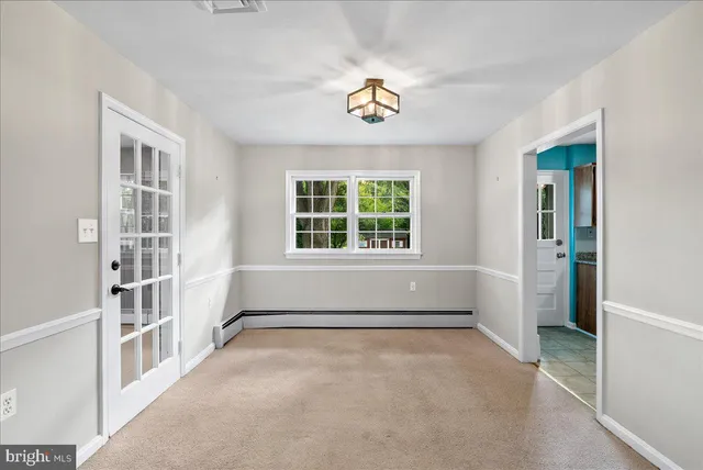 an empty room with windows