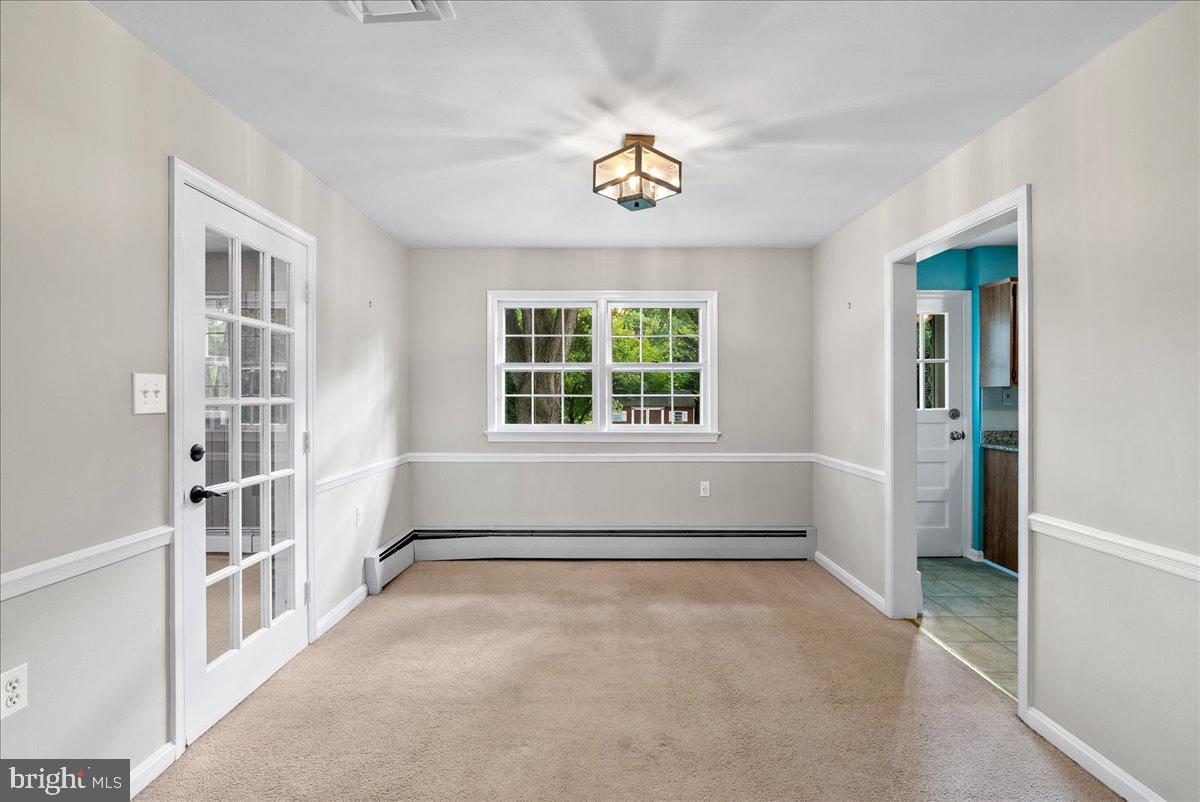 919 Ednor Road Silver Spring, MD 20905 - Photo 4 of 29 an empty room with windows