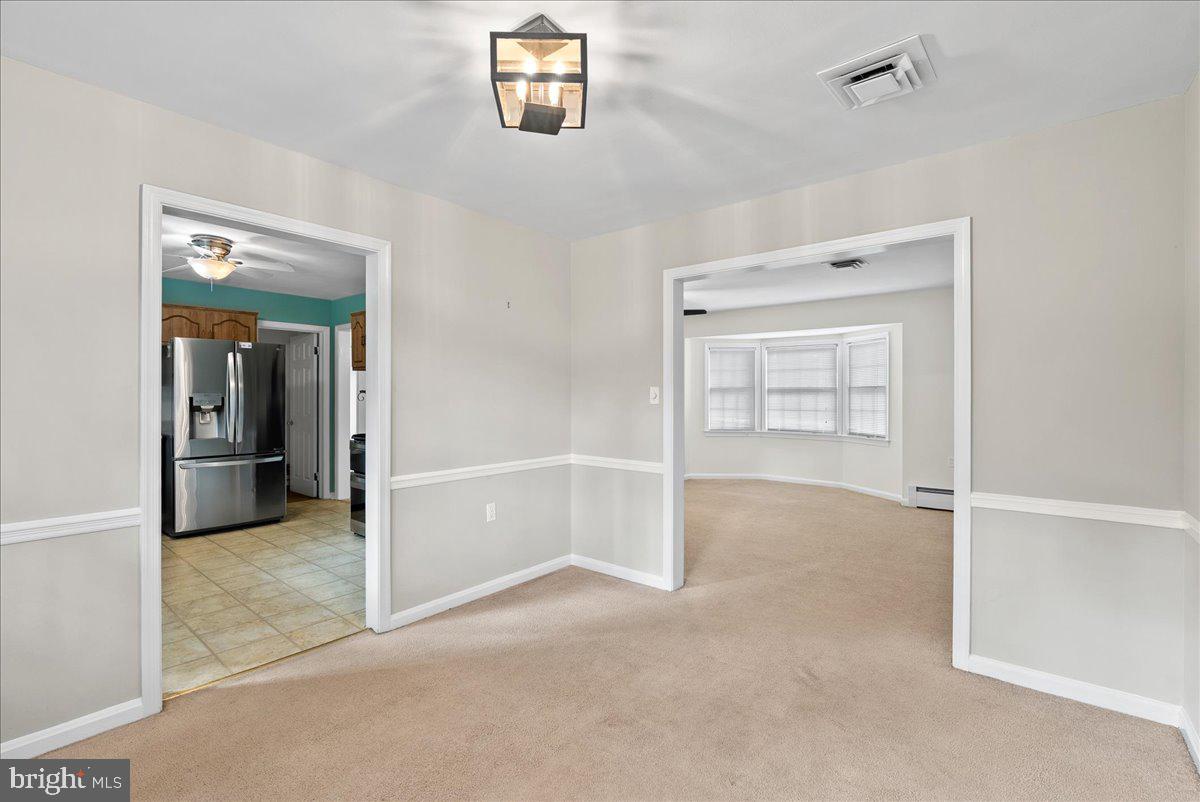 919 Ednor Road Silver Spring, MD 20905 - Photo 8 of 29 an empty room with windows and closet