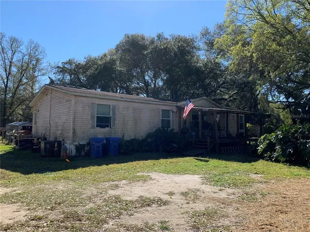 an aerial view of a balcony with chairs