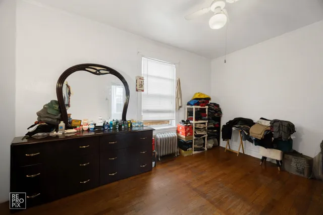 a living room with furniture and a mirror