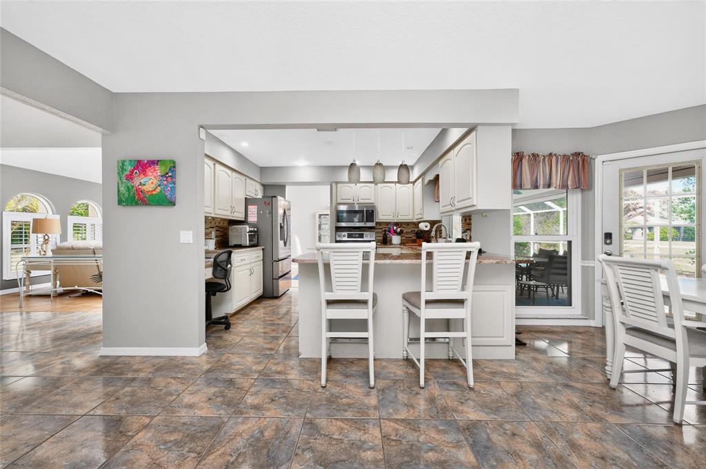 100 Angol Street Punta Gorda, FL 33983 - Photo 14 of 56 a dining room with furniture and a kitchen view