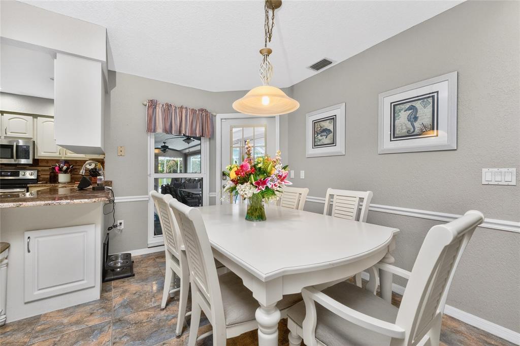 100 Angol Street Punta Gorda, FL 33983 - Photo 16 of 56 a dining room with furniture and chandelier