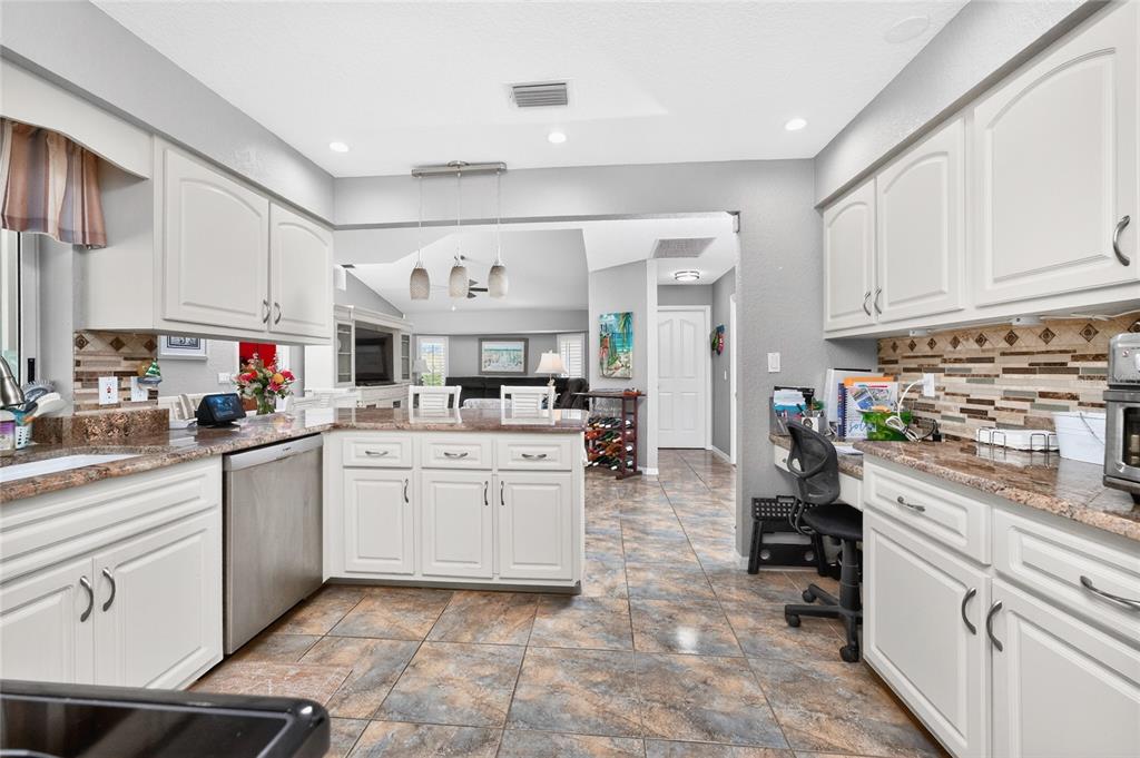 100 Angol Street Punta Gorda, FL 33983 - Photo 20 of 56 a kitchen with cabinets appliances and a counter top space