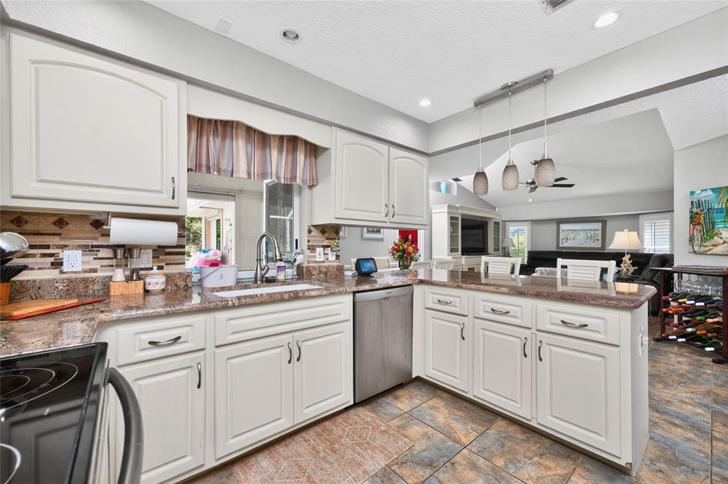 100 Angol Street Punta Gorda, FL 33983 - Photo 21 of 56 a kitchen with a sink window and cabinets