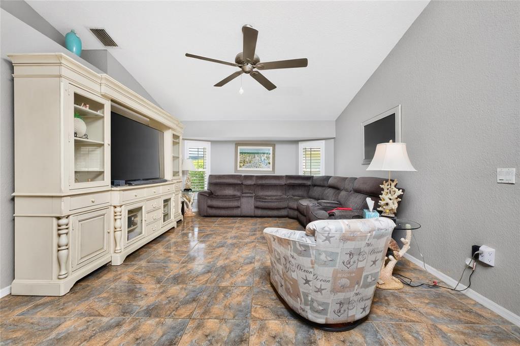 100 Angol Street Punta Gorda, FL 33983 - Photo 26 of 56 a living room with furniture and a flat screen tv