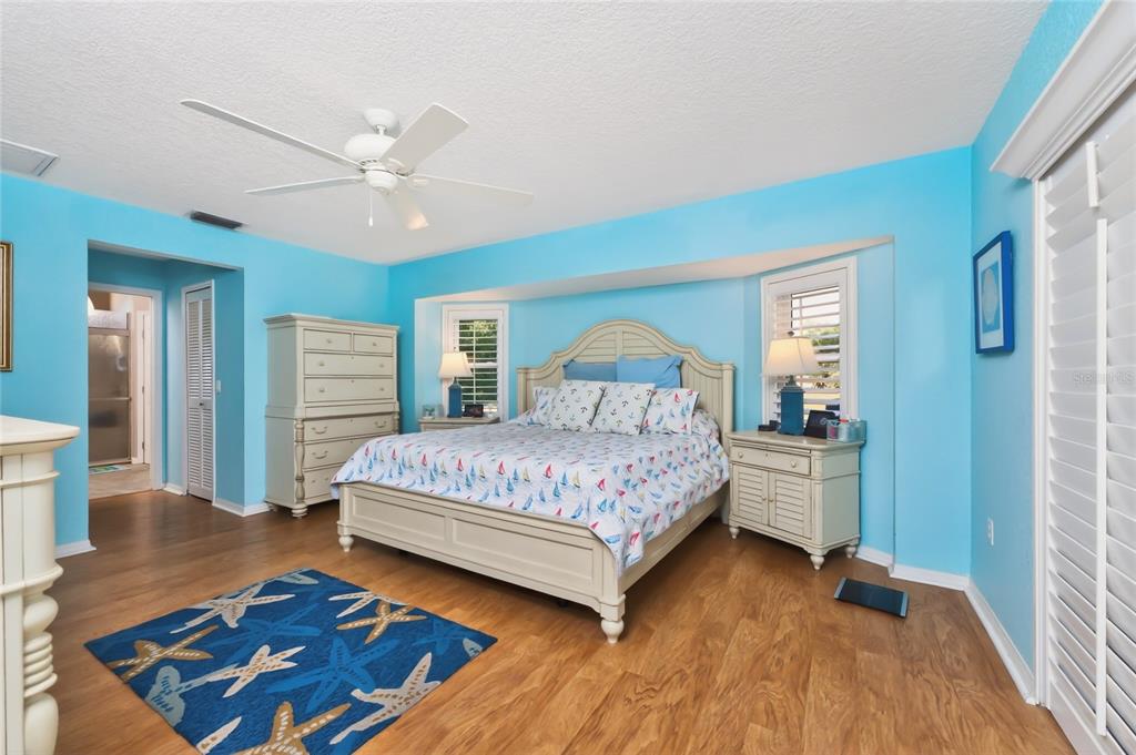 100 Angol Street Punta Gorda, FL 33983 - Photo 28 of 56 a bedroom with a bed and wooden floor