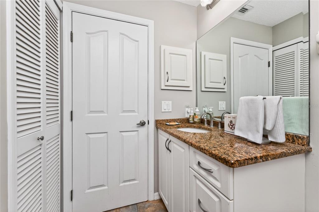 100 Angol Street Punta Gorda, FL 33983 - Photo 36 of 56 a kitchen with granite countertop cabinets and sink