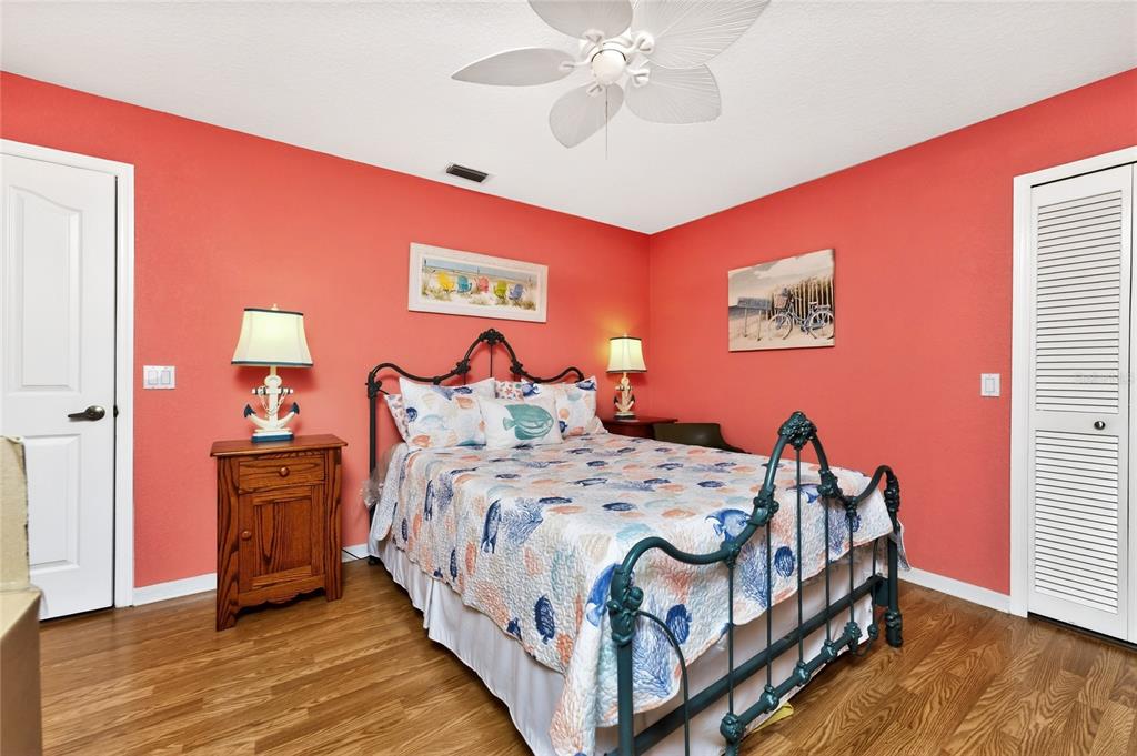 100 Angol Street Punta Gorda, FL 33983 - Photo 38 of 56 a bedroom with bed and wooden floor