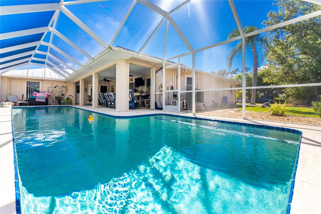 100 Angol Street Punta Gorda, FL 33983 - Photo 4 of 56 a view of a swimming pool with a patio