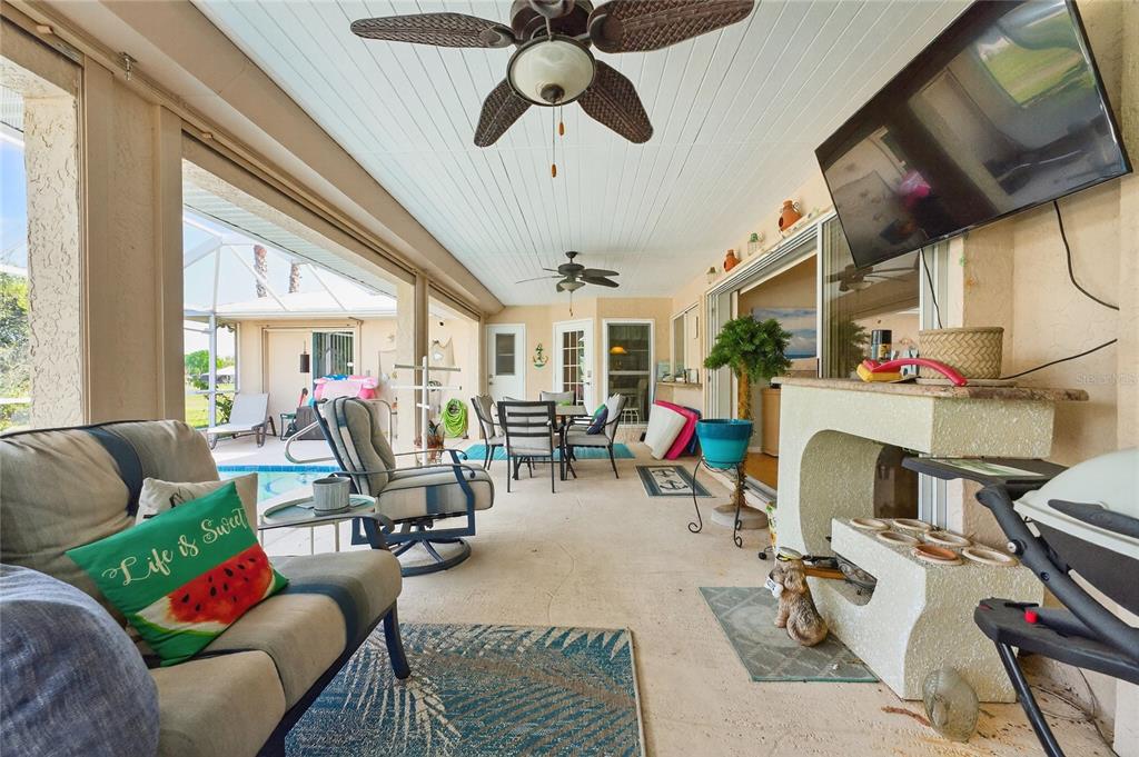 100 Angol Street Punta Gorda, FL 33983 - Photo 41 of 56 a living room with lots of furniture and a chandelier