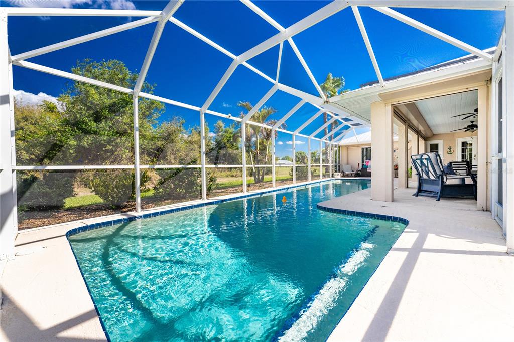 100 Angol Street Punta Gorda, FL 33983 - Photo 44 of 56 a view of a backyard with a swimming pool