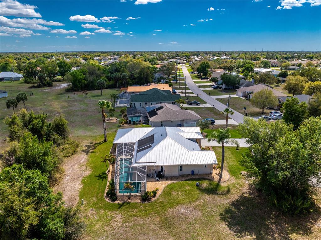 100 Angol Street Punta Gorda, FL 33983 - Photo 53 of 56 an aerial view of a house with a yard lake view and mountain view