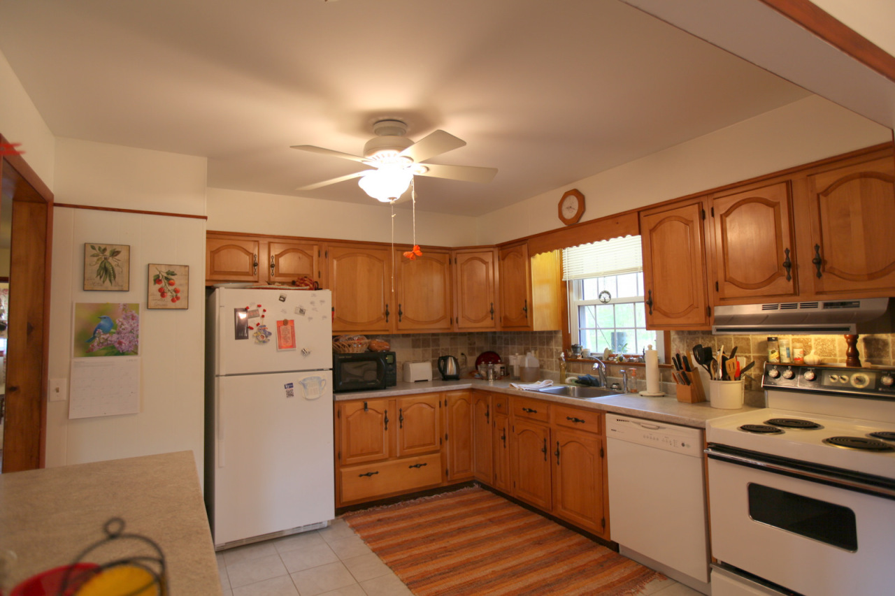 2116 Swamp Road Richmond, MA 01254 - Photo 5 of 16 a kitchen with a refrigerator a sink and cabinets