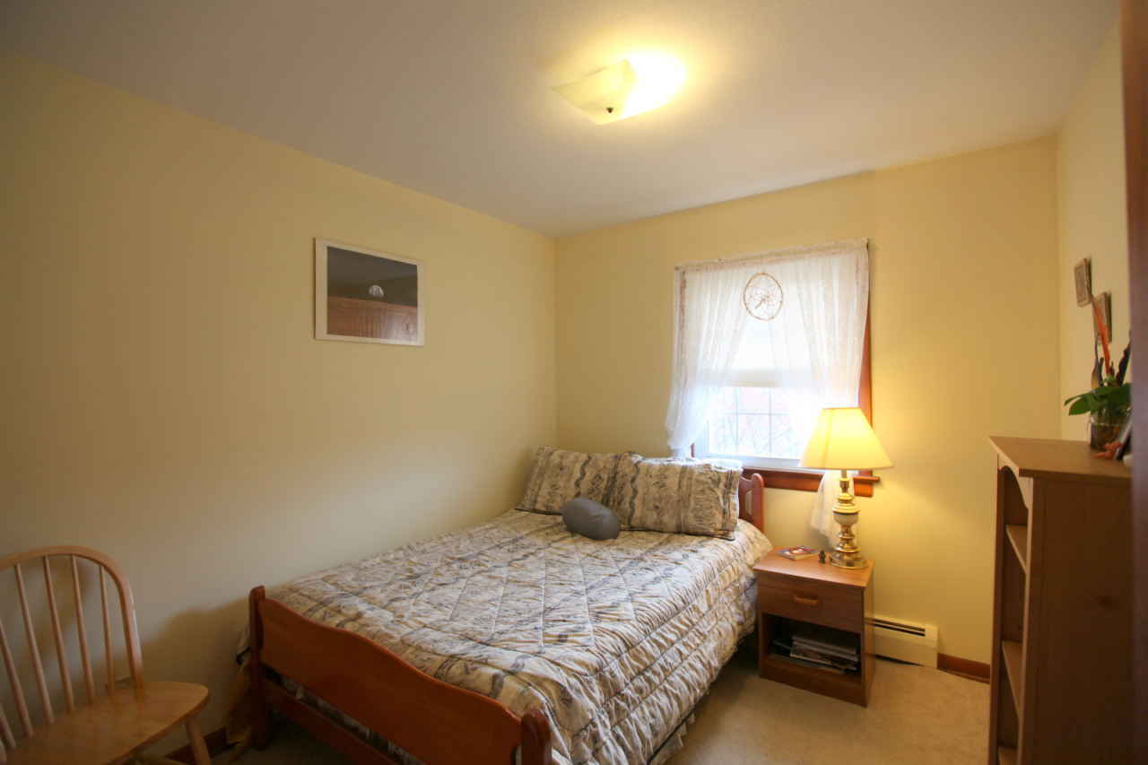 2116 Swamp Road Richmond, MA 01254 - Photo 6 of 16 a bedroom with a bed and a chair