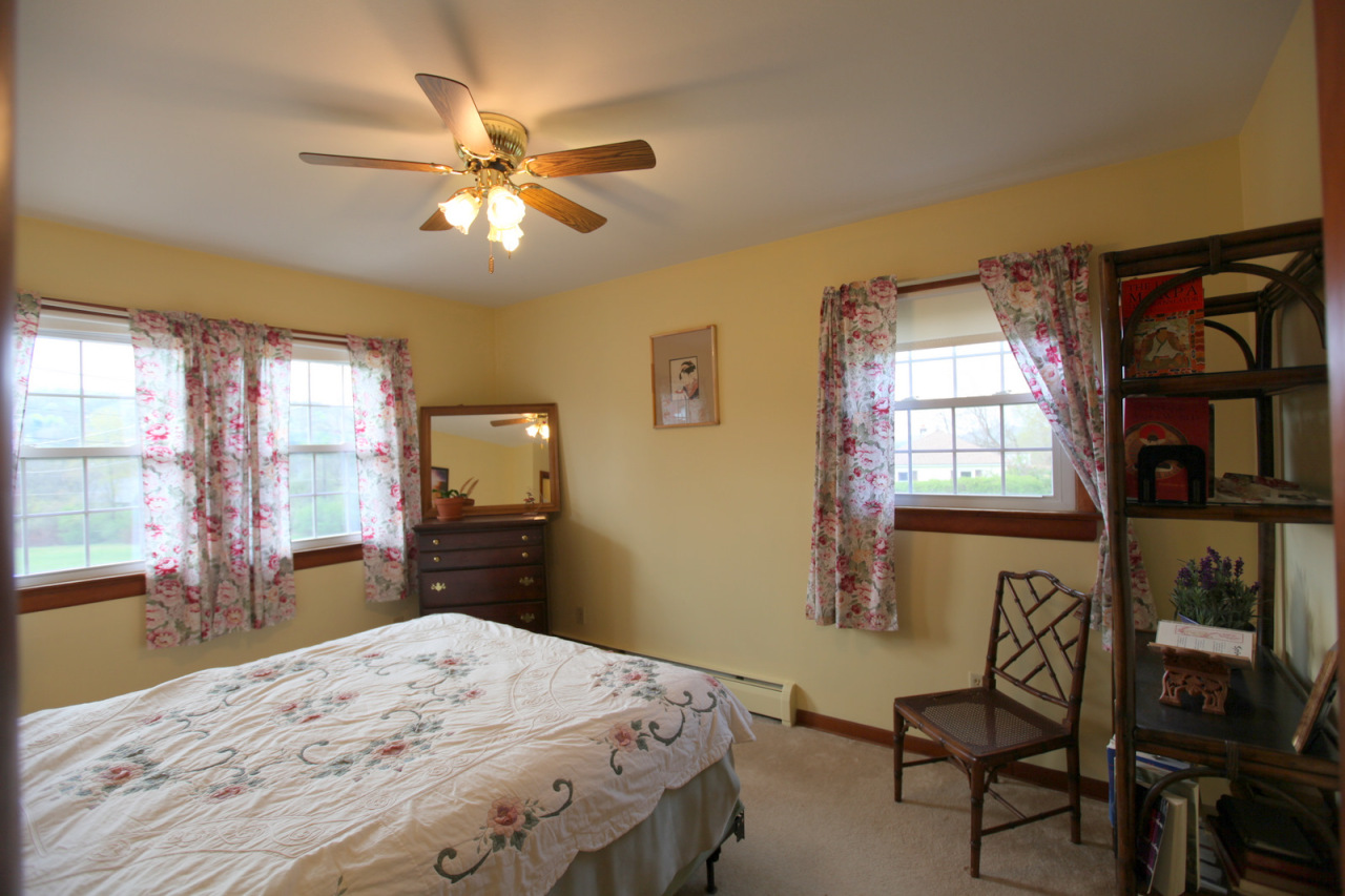 2116 Swamp Road Richmond, MA 01254 - Photo 7 of 16 a bedroom with a bed and wooden floor