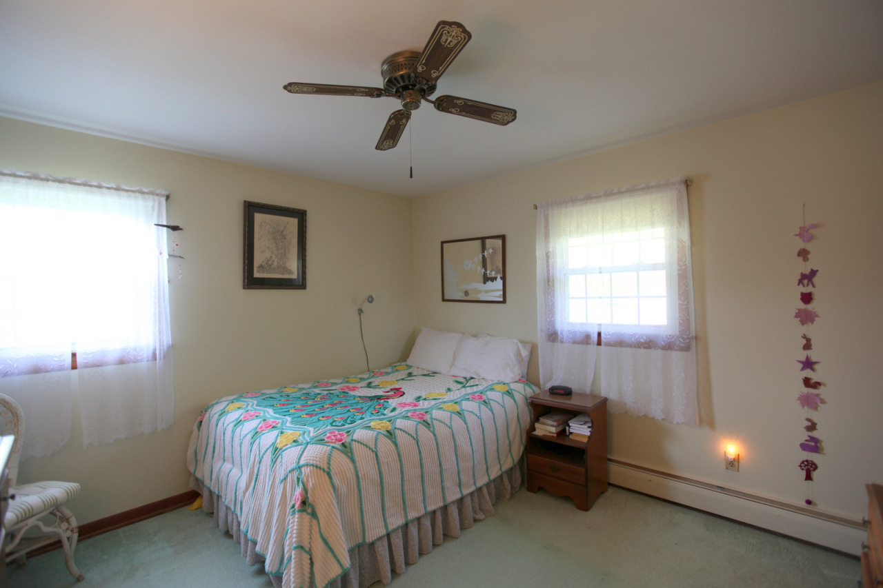 2116 Swamp Road Richmond, MA 01254 - Photo 8 of 16 a bedroom with a bed and a window