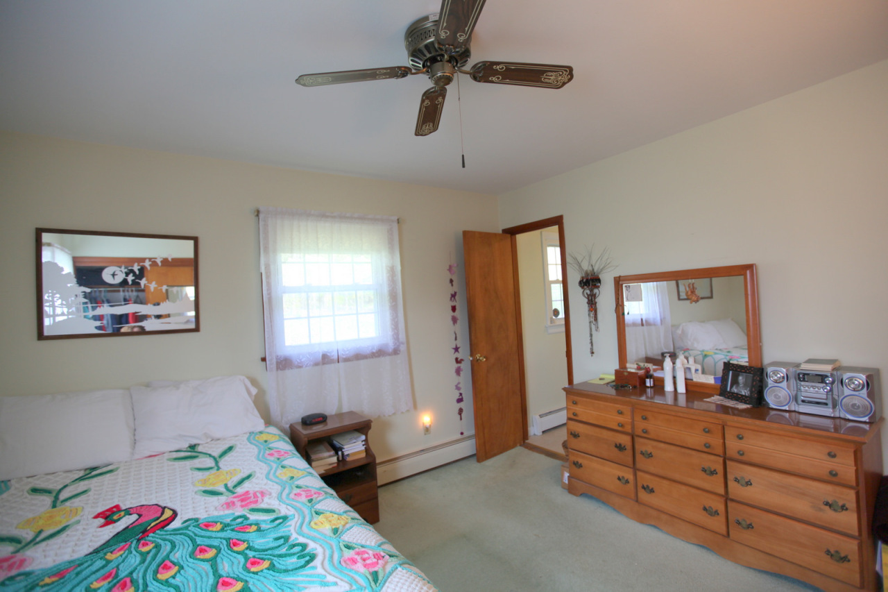 2116 Swamp Road Richmond, MA 01254 - Photo 9 of 16 a bed room with a bed and a dresser in it