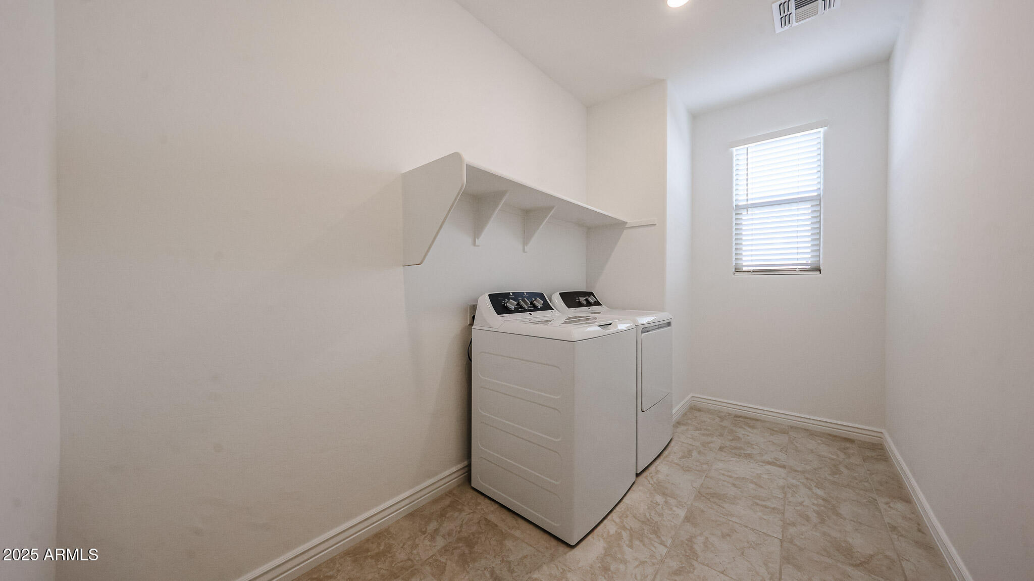 25051 North 171st Avenue Surprise, AZ 85387 - Photo 16 of 19 a utility room with dryer and washer