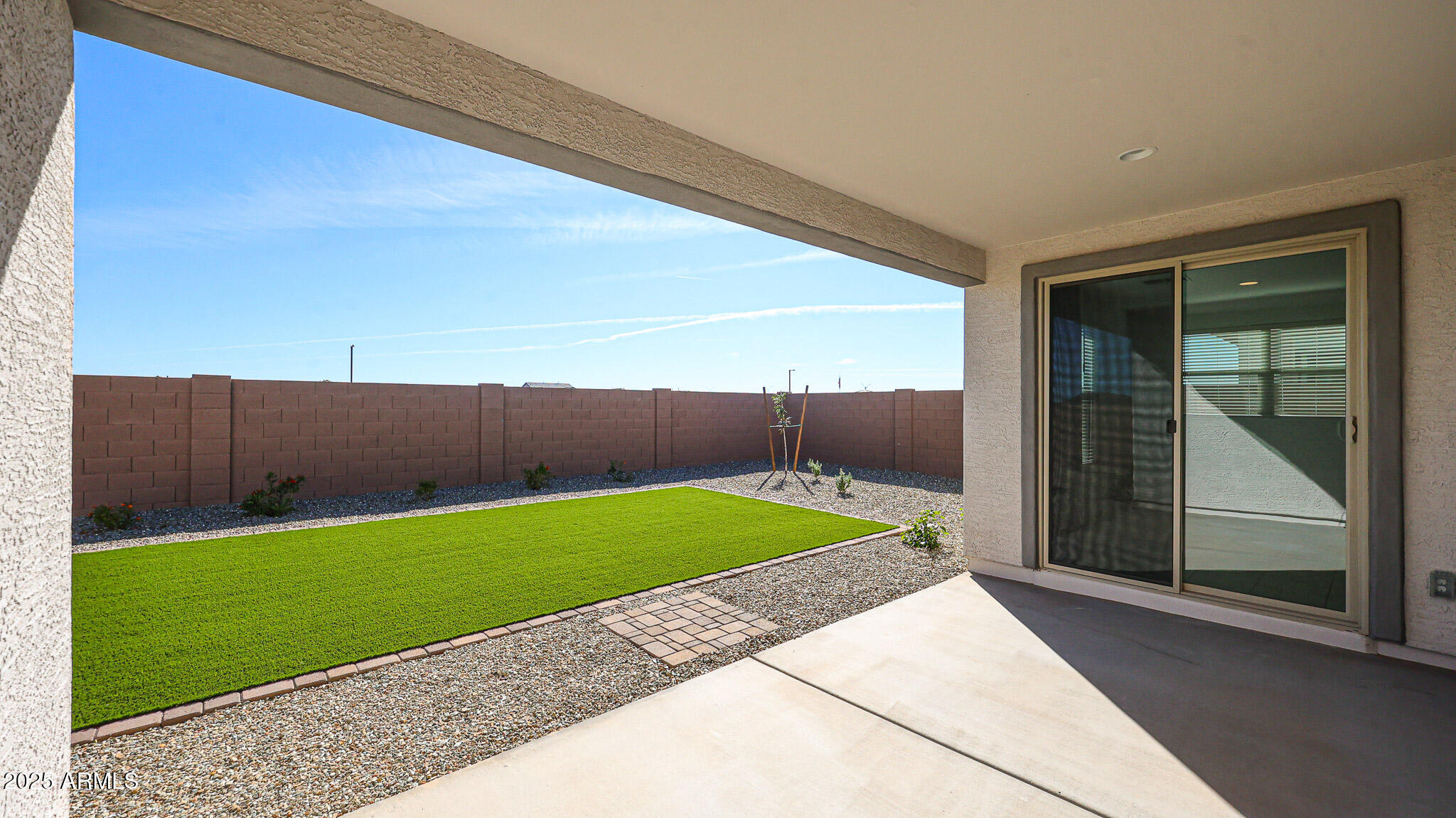 25051 North 171st Avenue Surprise, AZ 85387 - Photo 19 of 19 a view of backyard with seating area and wooden fence