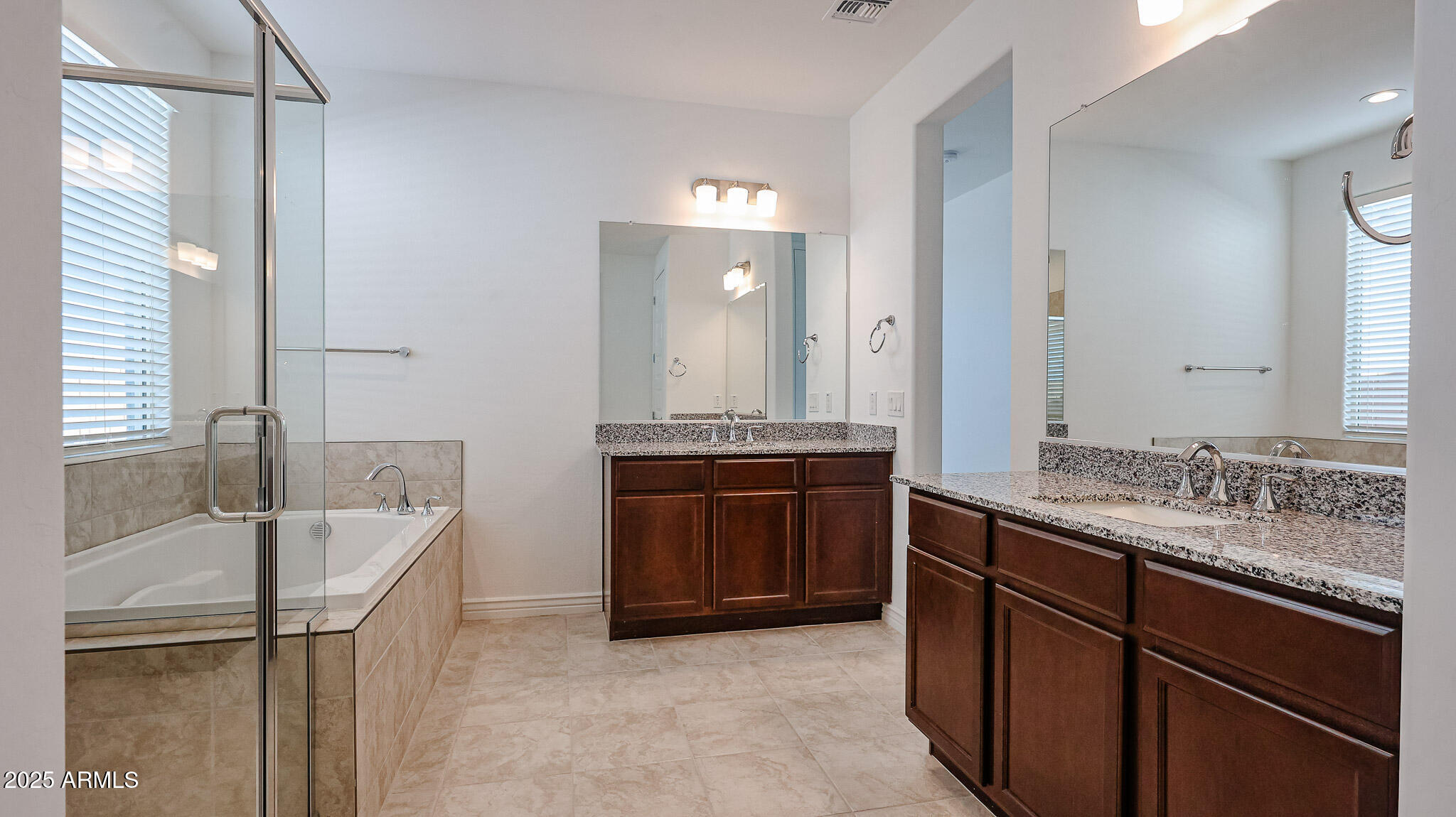 25051 North 171st Avenue Surprise, AZ 85387 - Photo 9 of 19 a bathroom with a tub sink and mirror