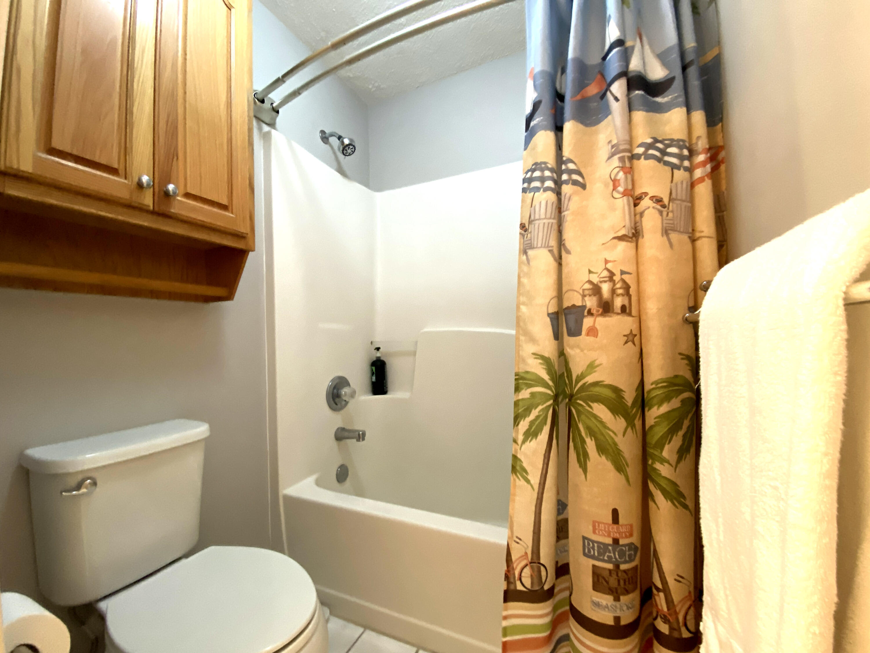 4466 Kingslynn Road Niceville, FL 32578 - Photo 46 of 77 a white toilet sitting next to a bath tub