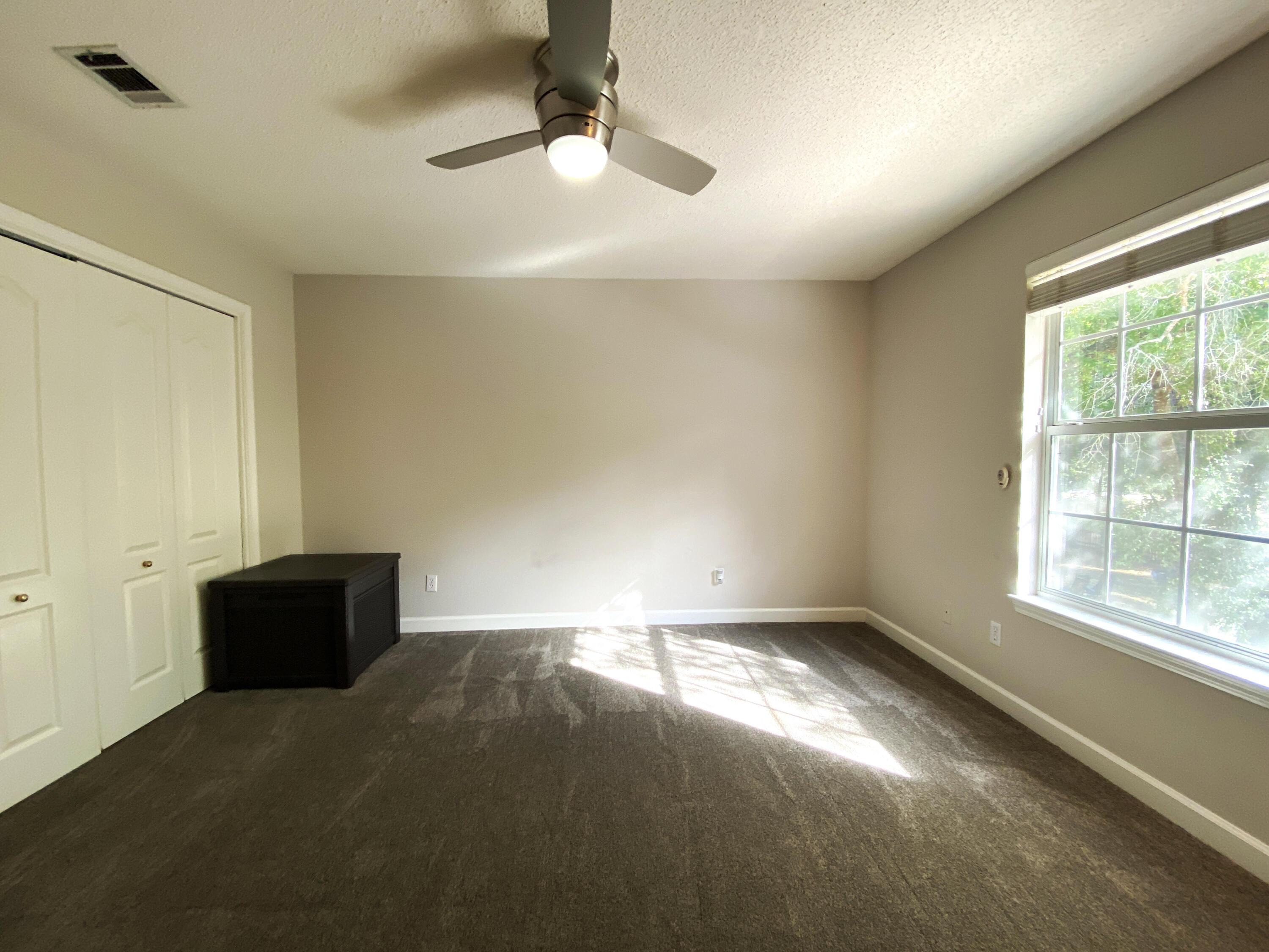 4466 Kingslynn Road Niceville, FL 32578 - Photo 47 of 77 an empty room with windows