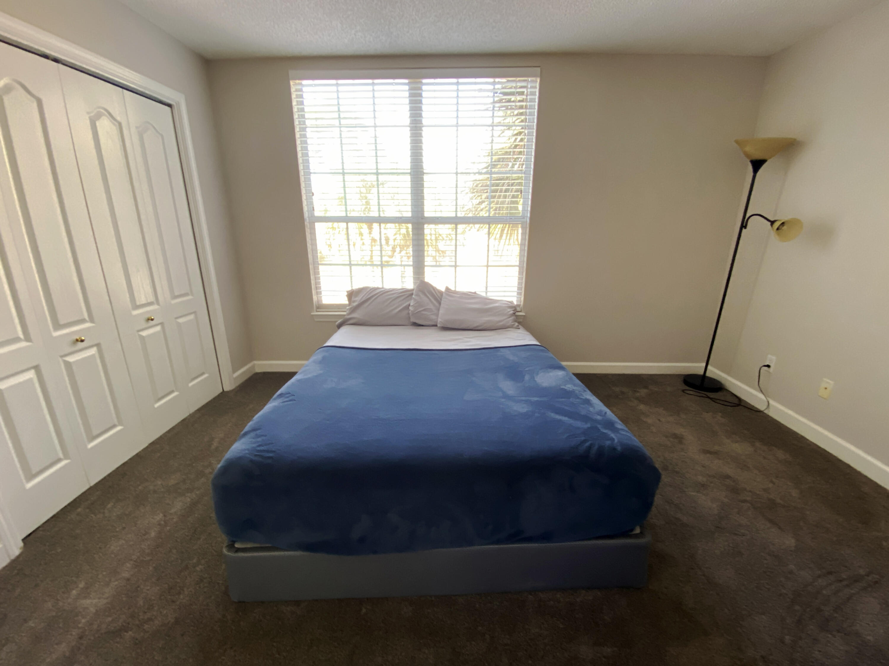 4466 Kingslynn Road Niceville, FL 32578 - Photo 51 of 77 a bed sitting in a room next to a window