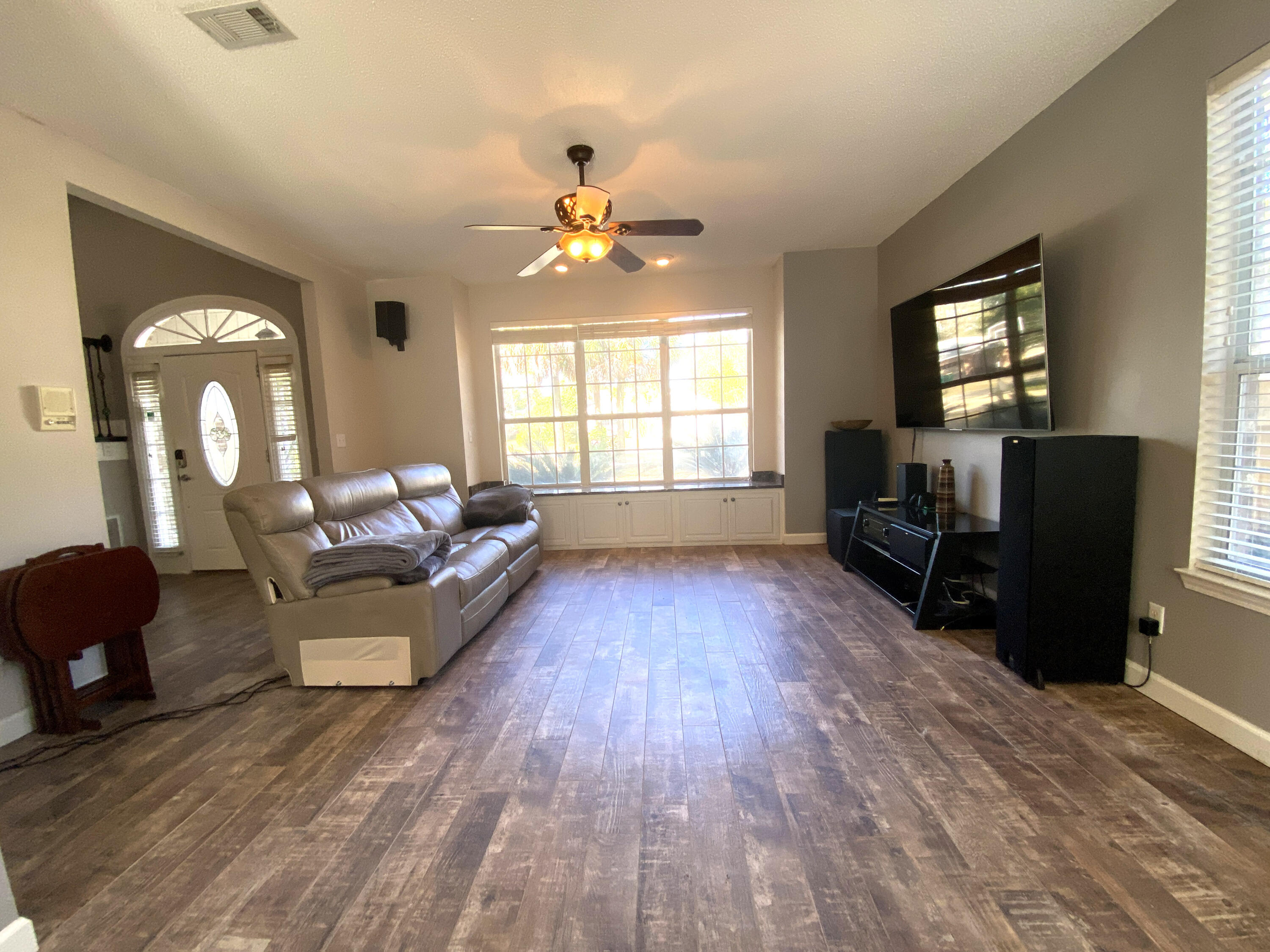 4466 Kingslynn Road Niceville, FL 32578 - Photo 8 of 77 a living room with furniture and a fireplace