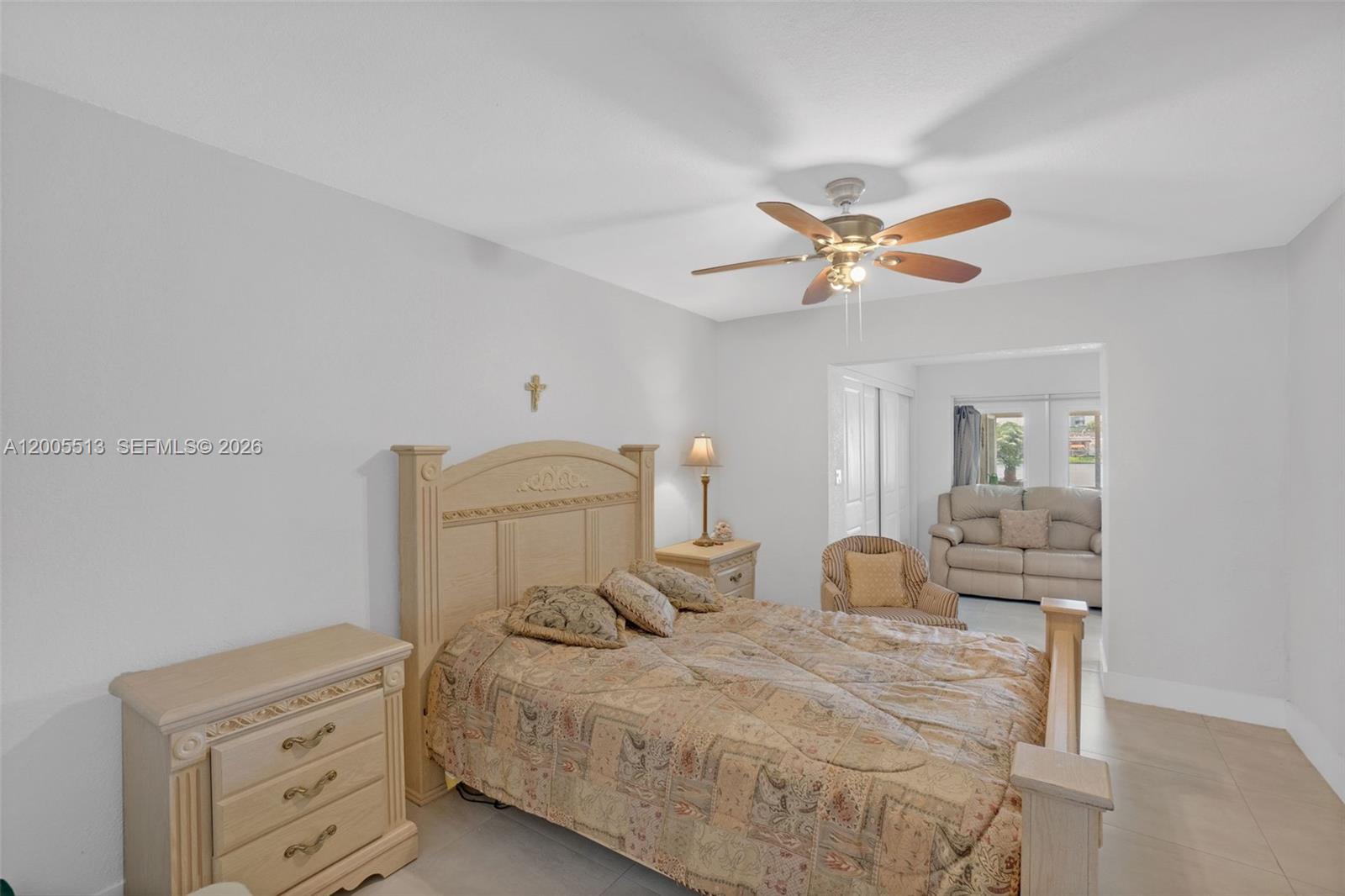 862 West 79th Street Hialeah, FL 33014 - Photo 16 of 34 a bedroom with a bed and a chandelier