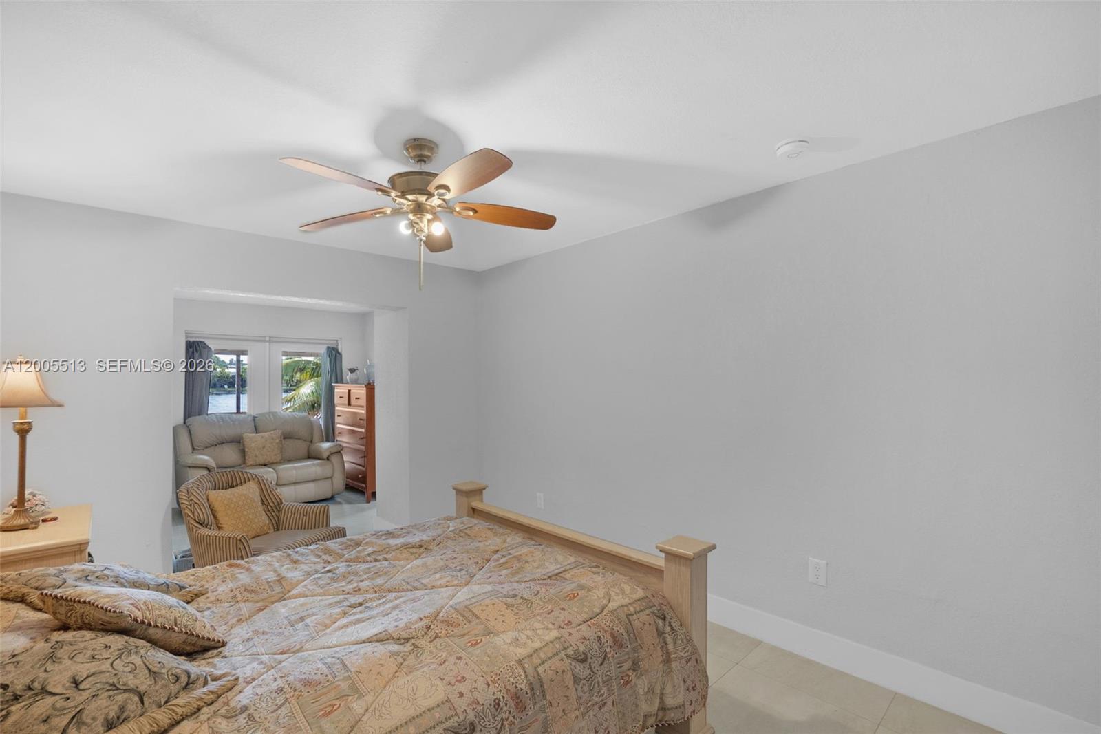 862 West 79th Street Hialeah, FL 33014 - Photo 17 of 34 a bedroom with a bed and a chandelier