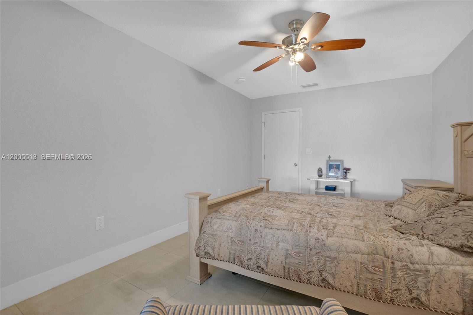 862 West 79th Street Hialeah, FL 33014 - Photo 18 of 34 a bedroom with a bed and a ceiling fan