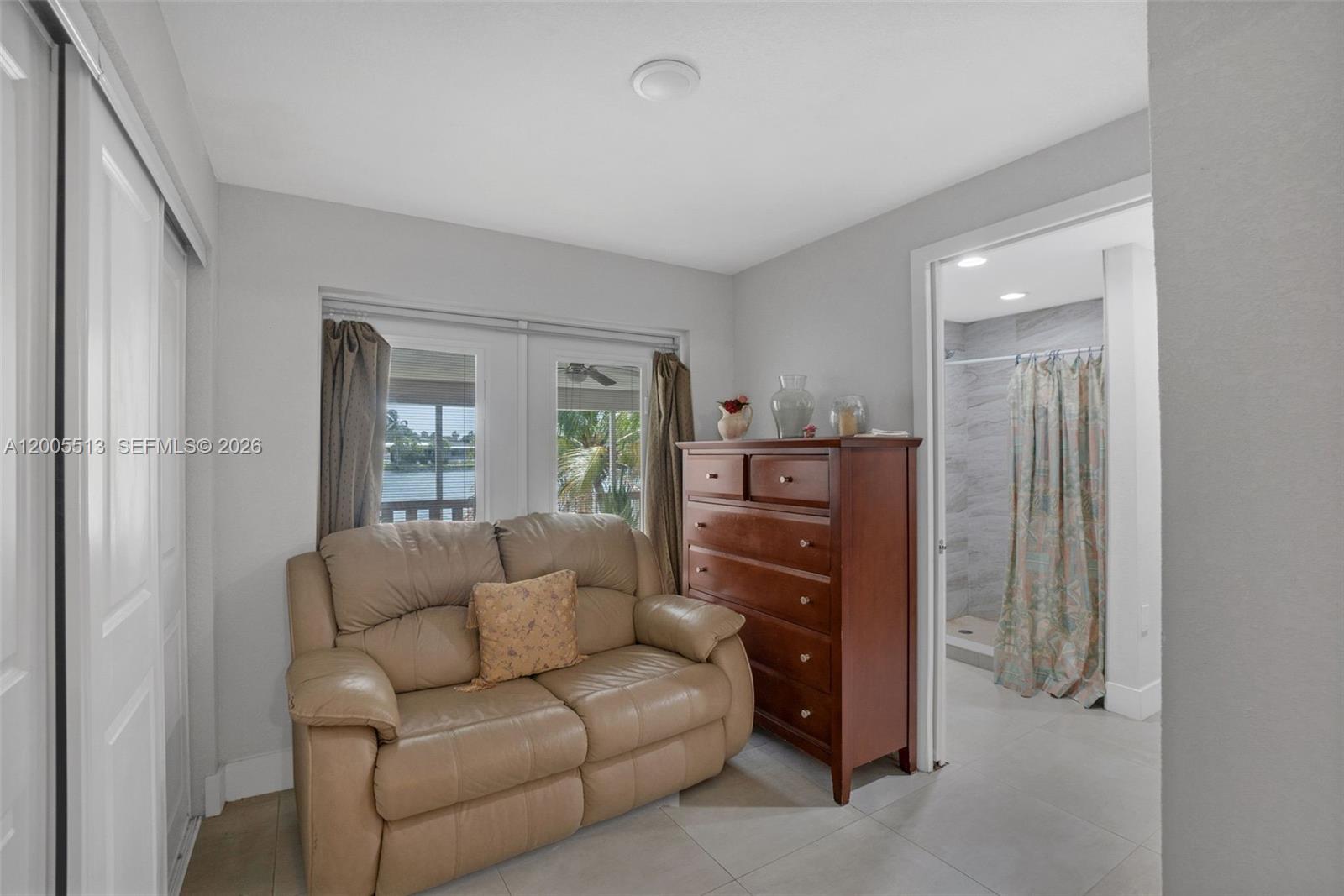 862 West 79th Street Hialeah, FL 33014 - Photo 19 of 34 a living room with furniture and a window