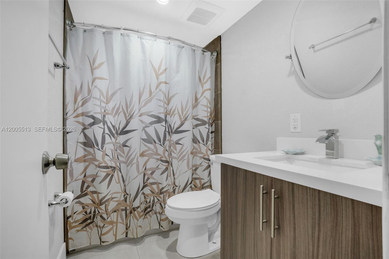 862 West 79th Street Hialeah, FL 33014 - Photo 23 of 34 a bathroom with a granite countertop sink and a mirror