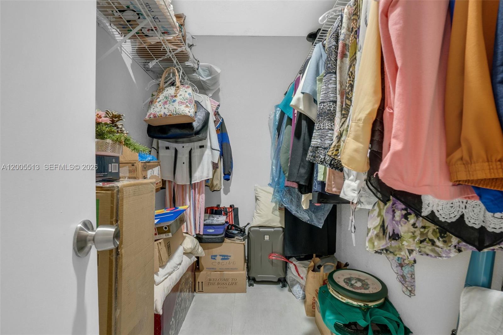 862 West 79th Street Hialeah, FL 33014 - Photo 24 of 34 a view of walk in closet with clothes and shoes