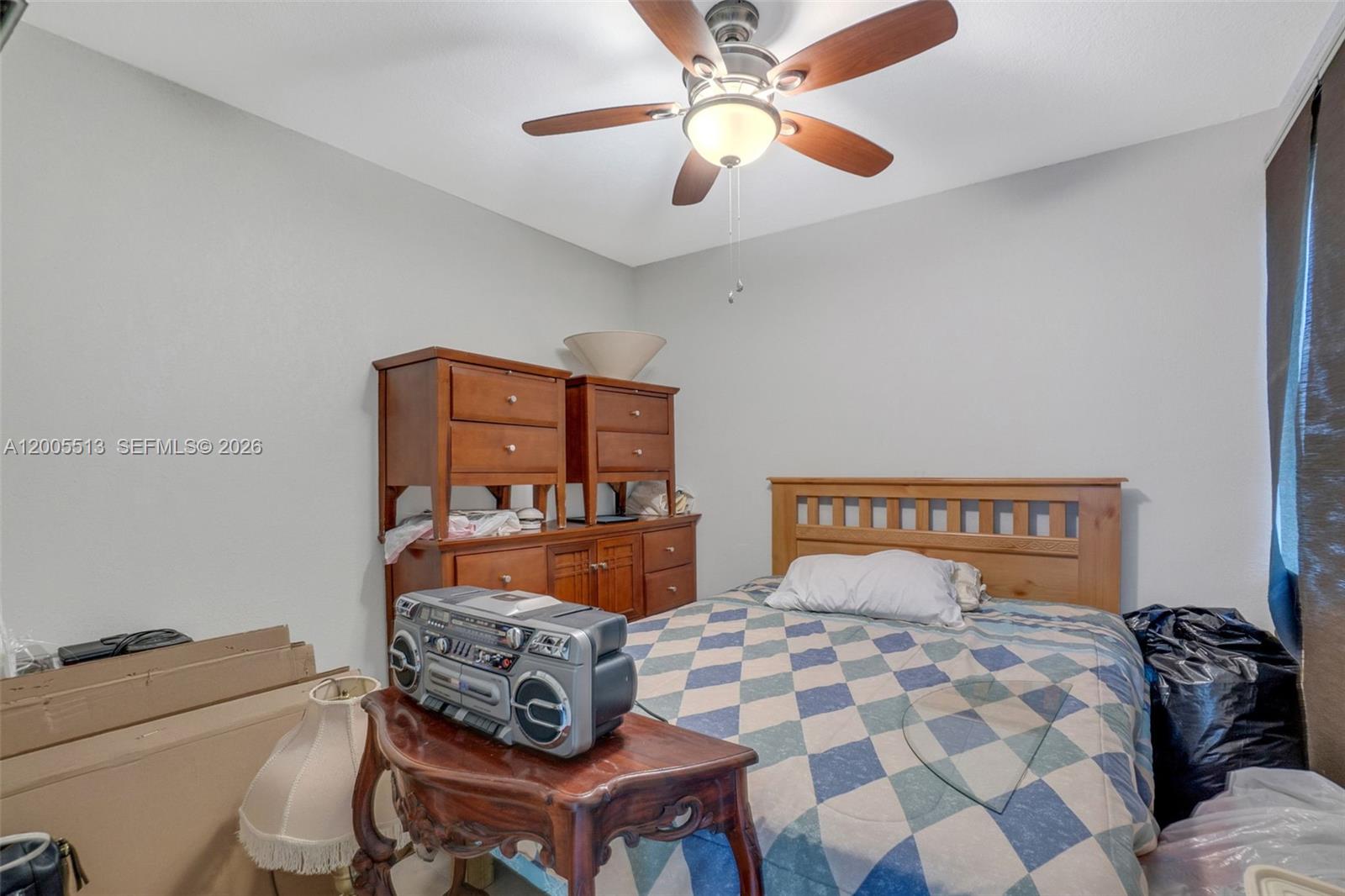 862 West 79th Street Hialeah, FL 33014 - Photo 25 of 34 a bedroom with a bed and a chandelier