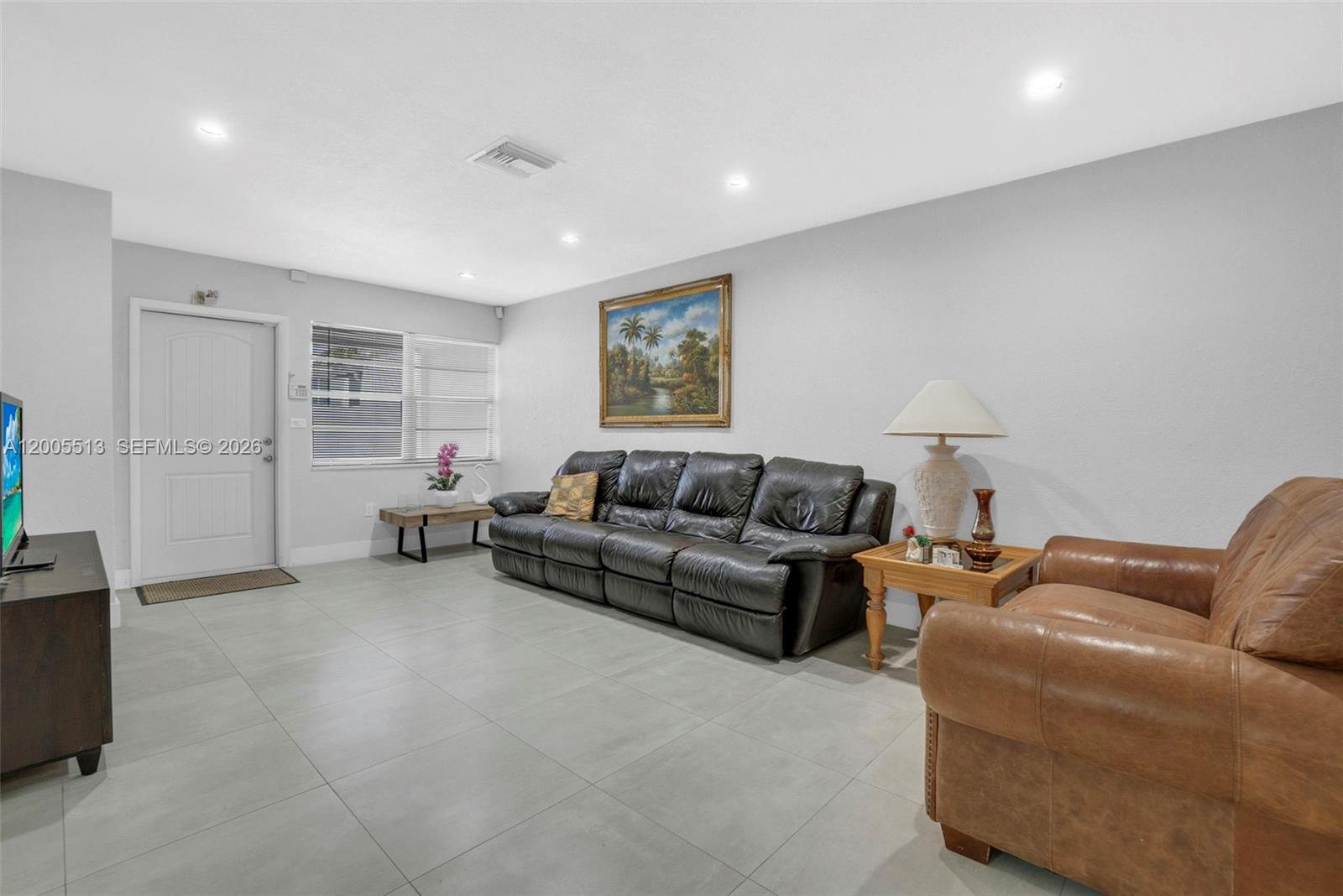 862 West 79th Street Hialeah, FL 33014 - Photo 4 of 34 a living room with furniture and a window