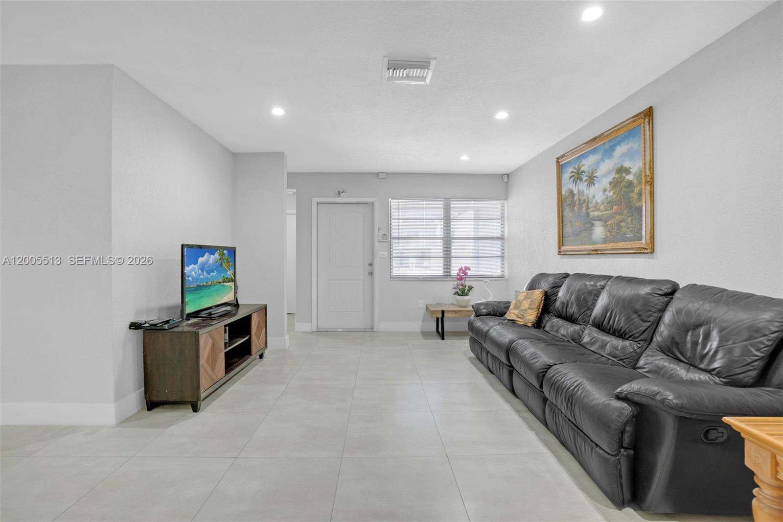 862 West 79th Street Hialeah, FL 33014 - Photo 5 of 34 a living room with furniture and a flat screen tv