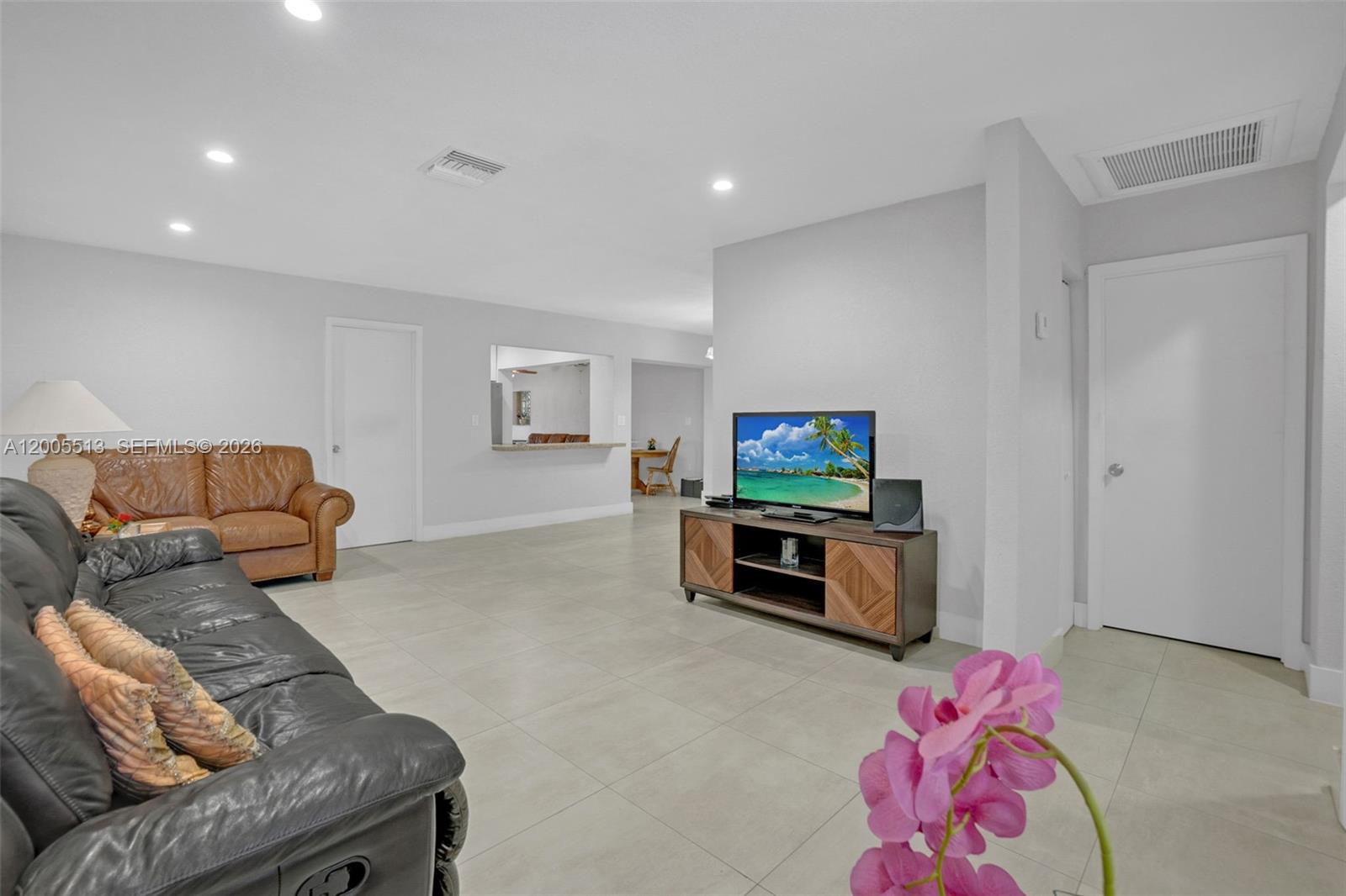 862 West 79th Street Hialeah, FL 33014 - Photo 6 of 34 a living room with furniture and a flat screen tv